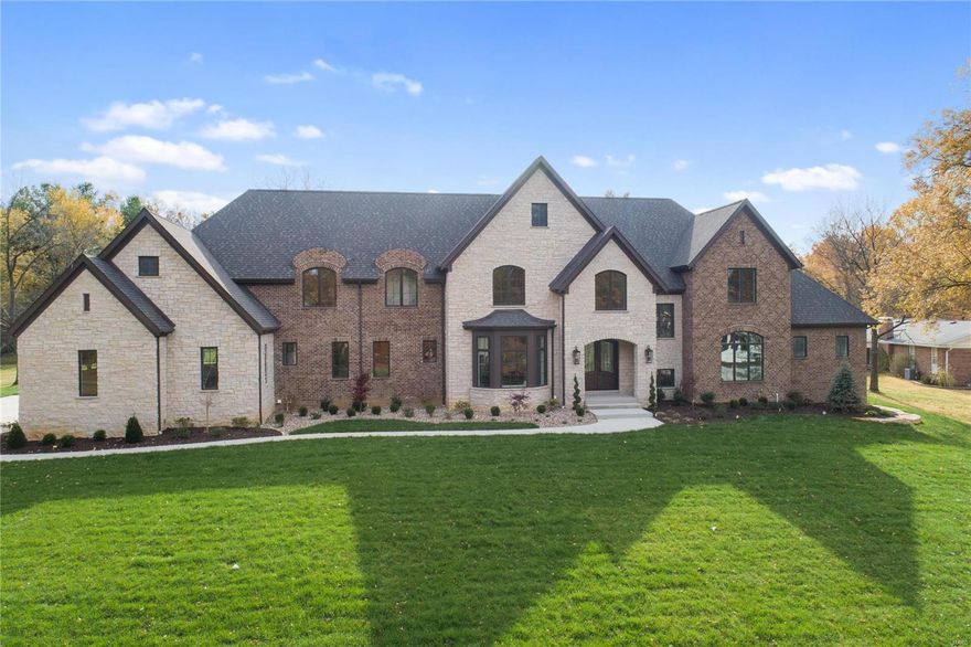 Prepare to be Amazed!! New Circle Front drive is in the works! Privacy trees being planted. Ellie Cade Homes, LLC certainly raised the bar for YOU. Premier estate home on a 1-acre level lot that’s perfect for a sports court or pool.  Breathtaking “diamond bond” brick details and cut stone highlight the front elevation. Level rear yard invites entertaining areas for Pool and Sports courts. Inviting access from Lower Level “Walk-Up’’ boasts 6th bedroom ensuite, full kitchen & bar, Rec room, pool bath & gym. The stunning kitchen adjoins cathedral ceiling hearth room (22ft clg) w/fireplace and a wall of windows. 2 sets of French doors accessing two very private patios. Covered porch with fireplace and rich tongue & groove wood ceiling. Don’t forget Southern exposure that is begging for outdoor living. Yes, the master suite is on the main floor and adjoins the library or office. The guest ensuite also on the main floor. A 4-car garage has storage niches. There are 2 laundry rooms as well. Additional Rooms: Mud Room