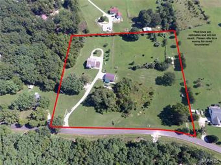 Charming 6 year old home on over 5 acres in a pretty setting. 2 bedroom (possible 3rd), 2 1/2 bath, nice kitchen with custom cabinets and ceramic tile backsplash, 1 car oversized attached garage with workshop area, 2 car detached 30 X 40 shop with electric, work benches, shelving w/ attached pole shed. Whole home Generac generator installed in 2016. 18 X 12 composite deck installed 2018. Enclosed RV shed with 16 ft garage door with electric, water, it's own septic tank on 16 X 18 slab. Underground pet fence. Additional Rooms: Sun Room