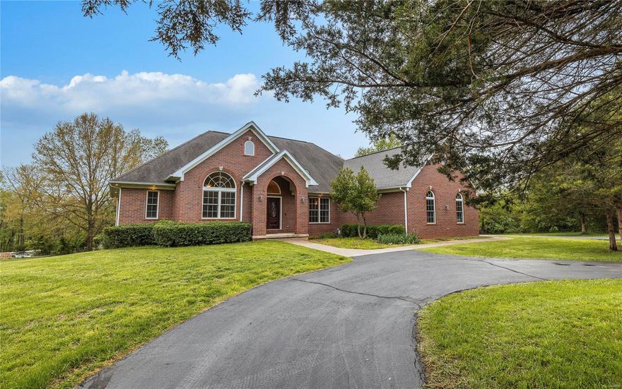 ALL BRICK, CUSTOM BUILT HOME BY JIM LARSON EXUDES QUALITY ALL THROUGHOUT THE HOME. WELCOME GUEST INTO YOUR HOME WITH EASE & SPACIOUSNESS. THIS HOME SITS ON 3.17AC(M/L) IN A VERY SOUGHT AFTER NEIGHBORHOOD. AS YOU WALK INTO THE BEAUTIFUL ENTRYWAY, YOU WILL NOTICE THE CUSTOM ANDERSON WINDOWS, ONE OF MANY CUSTOM FEATURES. OTHER CUSTOM FEATURES INCLUDE BUILT-IN SHELVING, FIREPLACE IN THE LIVING ROOM, HARDWOOD FLOORS & RICHLY LAYERED CUSTOM MOLDING THROUGHTOUT THE MAIN LEVEL & COFFERED CEILINGS IN THE DINING AREA AND PRIMARY SUITE. THE LARGE KITCHEN INCLUDES GRANITE COUNTERTOPS, CUSTOM CABINETS, KITCHEN ISLAND & FRENCH DOORS WITH TRANSOM LEADING OUT ONTO THE BACK DECK. OFFICE WITH CUSTOM SHELVING HAS THE POTENTIAL TO BE MODIFIED INTO AN ADD'L BEDROOM. VAULTED CEILINGS IN THE LIVING AREA HAS PANORAMIC WINDOWS OVERLOOKING THE BACKYARD. THE WALKOUT LOWER LEVEL HAS A LARGE FAMILY ROOM WITH WET BAR & LOTS OF STORAGE ROOM. UNFISHED AREA IS READY TO BE FINISHED FOR AN ADDITIONAL BEDROOM & BATHROOM.