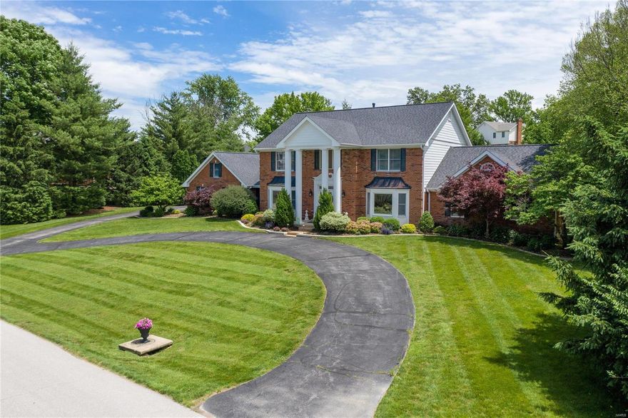 This five bedroom gem has everything! Updated eat-in kitchen with custom cabinetry, center island with tons of storage, lighted cabinetry, two pantries, KitchenAide appliances, granite counter tops & planning desk. There is a main floor laundry room as well as a large storage room, plus two main floor powder rooms, one off the laundry room that serves the pool. This home boasts both formal and informal spaces that are both light filled and classically appointed including many notable features in the family room: a wet bar, gas fireplace & in-ceiling speakers. The main floor master suite is spacious and truly a retreat with its updated bathroom and large walk-in closet. Upstairs you will find 4 huge bedrooms and 2 updated hallway bathrooms with marble accents throughout. There is a large finished lower level with new carpet, wet bar & wine cellar.Huge yard with a covered pavilion, in-ground pool & new landscaping. Roof is 3 years old, newer windows throughout most of home, Hardie siding Additional Rooms: Mud Room, Wine Cellar