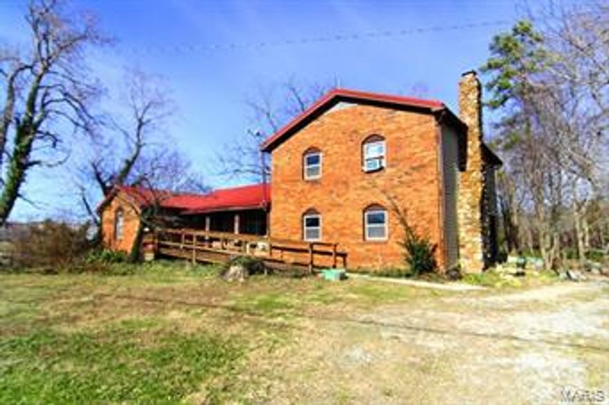 Don't miss this! 3.2 acres of state highway frontage. Nice level lot. Brick 1.5 story home with over 1400 ft., 2 bedrooms, 1 bath, full basement. Great gardening spot.