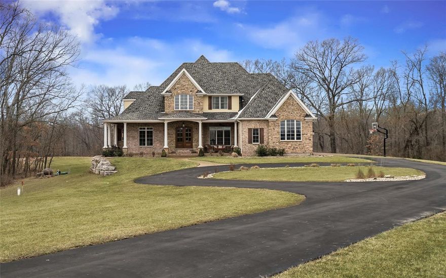 Nestled on approximately 7 acres, this stunning, five-year-old, 1 ½ story estate features 6 bedrooms, 7 bathrooms, beautiful hardwood floors, many windows & soaring ceilings that flood the interior with natural light and afford lovely views of the park-like grounds. The kitchens a chef’s delight with a huge island, Electrolux appliances including an induction stovetop & double built-in convection oven. The main floor master bedroom features a spa-like master bathroom with inlaid marble tiled floors, a jetted tub & an 11’x4’ tile & marble walk-in shower with multiple heads and body sprayers. The lower level features a billiard room (slate pool table stays), wet bar, a play room (that would make an amazing workout room or studio!), a concrete safe room & a guest suite with a sitting room. Your family will enjoy the heated, saltwater swimming pool, hot tub & outdoor fireplace. The jewel of this lovely home is the amazing grounds. It is a rare luxury home that will allow horses!