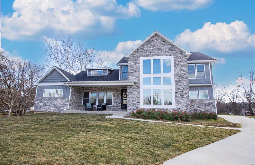 Move in ready in early September. Exquisite custom home on unheard of 1 acre level lot in Fenton! Thoughtfully designed & meticulously built, this 5000 sq ft home is what you have been looking for. With the attention to quality construction & detail, efficiency meets design with a Great Room w/ floor to ceiling stone fireplace, Gourmet Kitchen, & feature Window Wall. Kitchen with quartz countertops, Thomasville cabinets, SS appliance package, & hidden walk-in pantry. Split floor plan offers privacy for Main Floor Primary Suite w/ its free standing tub, double sinks, & walk-in closet. Main Floor Laundry & MudRoom w/ access to 24 ft deep 3-car side entry garage w/ 8ft high extra wide doors. Roughed In Lower Level ready for you to finish when & if you like. Smart Home Technology throughout. Photos of Display Home & Digital Renderings depict optional upgraded finishes. Call today to personalize your dream home! Additional Rooms: Mud Room