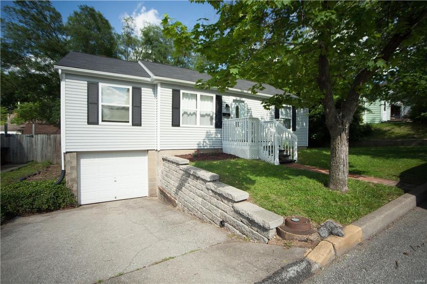 Cute ranch home with 4 bedrooms 1.5 bath in the Heart of St. Charles.  This home features hard wood floors throughout the main level and new ceramic tile flooring in the updated kitchen! The kitchen features updated counter tops, cabinets and all black appliances.  The main floor full bath has a newer flooring and vanity.   Home also features a partially finished lower level with extra family room. Don't miss the deck that is perfect for a BBQ, and over looks your private level backyard.  Just minutes from Main Street, Schools, Shopping and more.