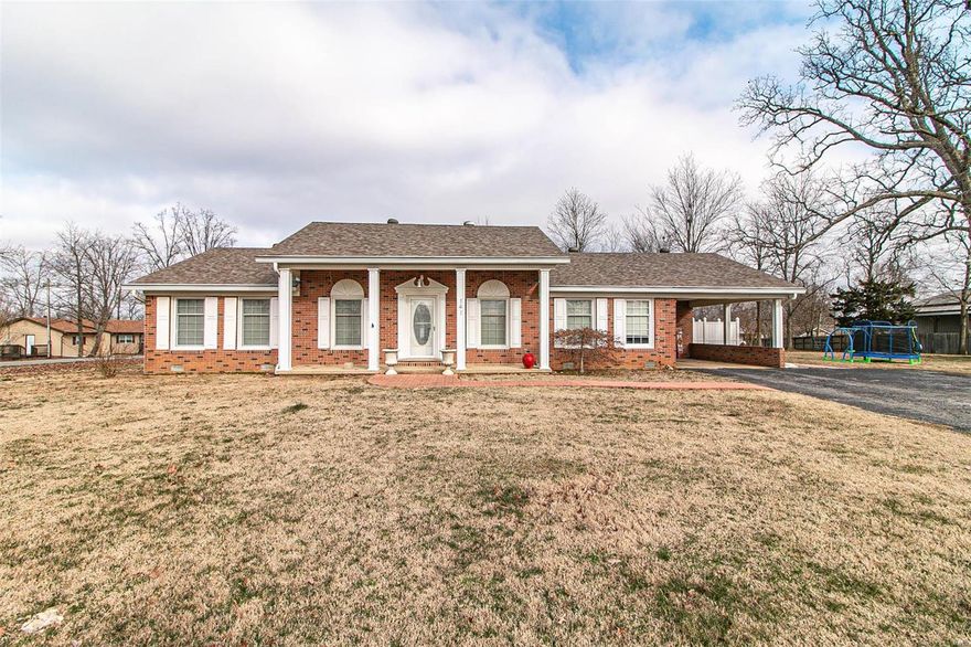 Beautiful 3 bedroom 2 bath home on large corner lot with large great room and sun room that overlooks inground pool with screened patio and pool house with bath and storage rooms, detached garage/workshop.