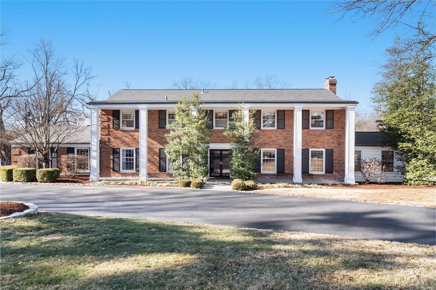 Come see this spacious colonial-style home on 1+ acres in Ladue School District. In the foyer, you are greeted with a winding staircase and openings to the large separate dining room and the living room, featuring a wood-burning fireplace and french doors to the covered porch. Off the living room is a cozy den or office, perfect for a quiet getaway. A spacious, updated kitchen with top-of-the-line appliances and a marble center island is great for entertaining. The kitchen opens up to a sun-filled hearth room with built-in bookcases, hardwood floors, wood-burning fireplace, and doors leading to the gorgeous covered outdoor living space. Upstairs, find a master suite retreat with remodeled marble bath, 4 other bedrooms. and 2 additional baths. The lower level is partially finished with a laundry room, a recreation room and a storage room. Go outside to find 2 outdoor living spaces, circular driveway, 3 car garage, and much more!