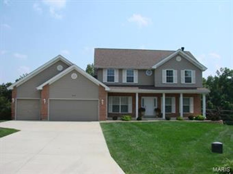 $30,000 PRICE REDUCTION!! ELEGANT 2 Story on quiet cul-de-sac eagerly awaits its proud new owner! Formal Dining Rm & Office/Den area frame a welcoming hardwood entry foyer. The sun-filled Family Rm features 5 window bay & fireplace (w/vented gas logs) flanked by built-in bookcases. A cook's kitchen is highlighted by gleaming hardwood flooring, center island, stainless dishwasher & range, tile back splash, 42" wood oak cabinets, planning desk & generous bayed Breakfast Room leading to a spacious deck overlooking the private back yard. Vaulted Master Suite features a large walk-in closet & private bath w/soaking tub, sep shower & dual vanity. 3 additional bedrooms & a full bath complete the upper level of this fabulous home. Finished Walk-out LL boasts Family/Rec/Media Rm, Wet Bar, Built-in Shelving, Half Bath & Lots of Storage space! Main Floor Laundry! 3 car garage! IMMACULATELY MAINTAINED & NICELY UPDATED! Great Location, Excellent schools, convenient to dining, shopping & hwy access!