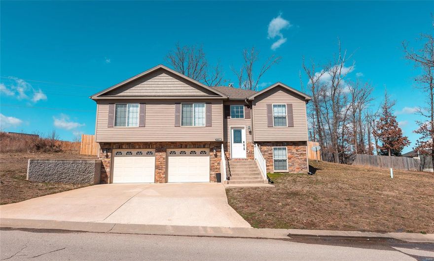 Gorgeous split foyer home, with stone detailing and vinyl siding on the outside! Walking up, you see the spacious 2 car garage and steps to the front entrance! Inside you can go upstairs to the living room, kitchen, and dining room combo with a semi open floor plan! On the end of the kitchen is the spacious laundry room! Down the hall, there are 3 bedrooms, one of them being the master suite which has a walk-in closet, as well as double sinks and lots of storage room throughout! Downstairs, you have a family area, a full bathroom, and a storage area! You can also walk into the garage from the lower level! Come check out this awesome one of a kind split foyer home, you don't want to miss it!!