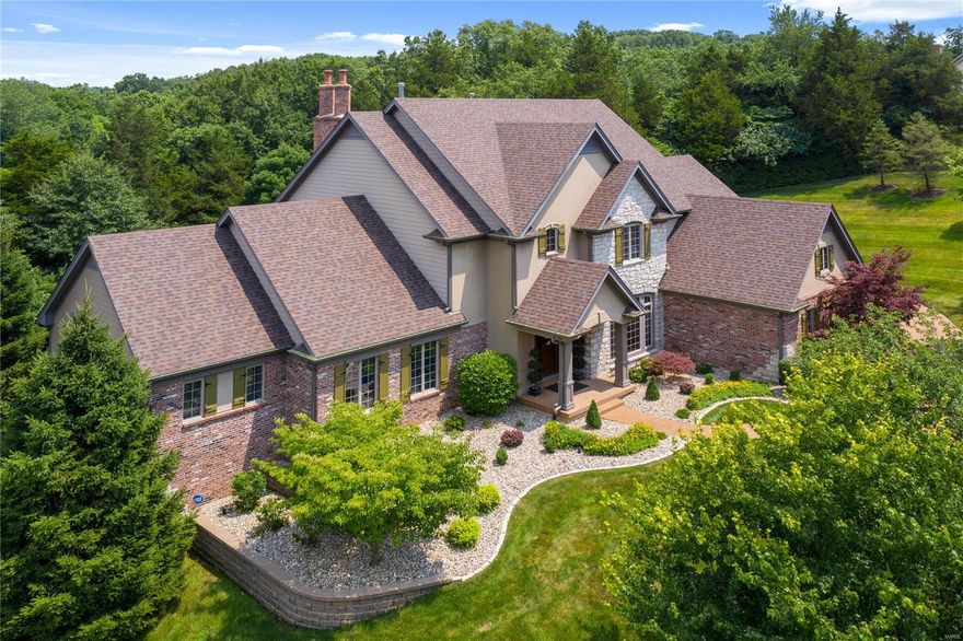 Absolutely immaculate 1.5 story home w/ custom features throughout. Situated on a 1+ acre private wooded lot, offering 6,400+ sqft of professionally finished living space & an inground pool! Enter to find the dining rm & study w/ wood floors, arched openings & built-in speakers. The stunning 2 story great rm features a wall of custom windows, built-in bookcases, walk-behind wet bar & fireplace. The heart of the home is the gourmet kitchen w/ granite countertops, breakfast & coffee bar, ss appliances & adjoining breakfast rm & vaulted hearth rm w/ a stone fireplace & access to the patio. ML master w/ bay window & lux bath w/ double vanities, jetted tub, w/i shower & 2 w/i closets. 3 UL bedrms & 2 full baths. W/o LL w/ a large rec rm w/ a fireplace & wet bar, game rm, theater rm w/ a projector & screen, exercise rm, bedrm & 2 full baths, one w/ access to the pool. Addtl features: ML laundry, 3 car garage, patio, fully repainted inside & out, & recarpeted (main levels). Truly a must see!