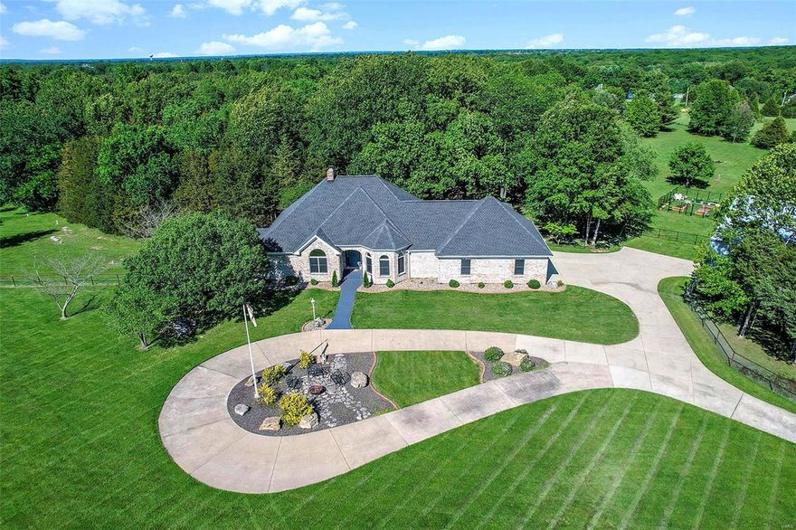 Attention pilots and airplane enthusiasts! Don’t miss out on this gorgeous 10-acre property that provides tranquility from the daily hustle and bustle yet is close to amenities, cultural events around St. Louis and the international airport.

This private community features a ½ mile grass airstrip that is shared amongst the community owners and allows for take offs and landings from your front step.

The home boasts 4 bedrooms, 4 bathrooms, finished lower level, walk out covered patio. A 60 x 60 insulated hangar, 40' bifold door with electric/ water plus a small garage for your garden tools. Recent added farm fence allows for horses or other livestock.

A beautiful large deck with gazebo overlooks the backyard pasture. The porch was recently updated with glass windows.

The great room features floor to ceiling windows with views of the yard & airstrip. The open and inviting kitchen with huge walk-in pantry is a chef’s dream. A fitness room is in the basement (equipment stays). Additional Rooms: Mud Room