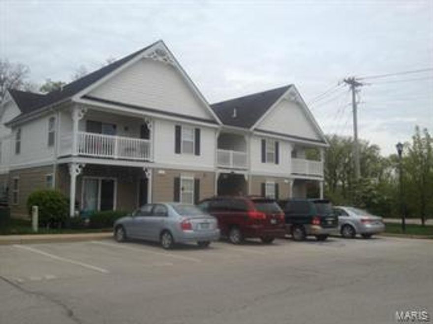 Like Brand New!  Newly painted, new carpet and BA floors.  Newer ceramic tile in kitchen and at front door makes this 2 BR, 2 BA condo like new.  Ground floor, private unit in rear of complex with gorgeous wooded view through patio doors.   Spacious open concept offers ceiling fans, lovely wooden Levelor blinds and in-unit full-size stack washer/dryer.  Kitchen has 42” maple cabinets and a breakfast bar. Large master BR has large walk-in closet, double-seated shower with double-bowl sinks and linen closet.  Second BR is nicely sized with generous closet.  This complex has all the amenities, clubhouse, pool and tennis courts.  Assigned parking completes this picture.  Make an appointment to see this one! Location: Corner Location, End Unit, Ground Level, Lower Level