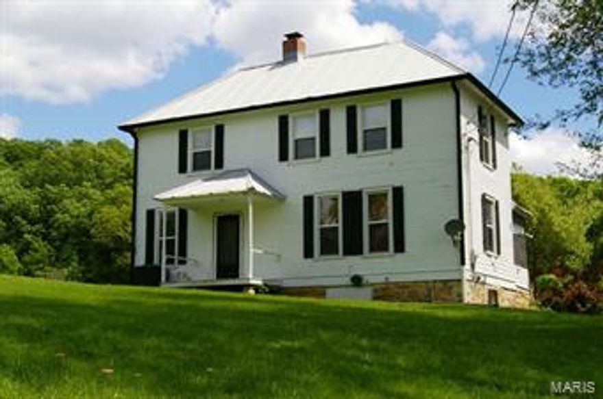 This is a unique opportunity to own a 313 acre hilltop farm overlooking the Meramec River Valley.  Conveniently located close to St. Louis via Hwy 44, this farm is easily accessible for a full time resident or a weekend homeowner.  The two-story historic farm house was built in 1906.  This home offers 3 bedrooms and 1.5 baths. The interior finish, moldings, doors and floors are original and in excellent condition.  Through the screened porch you are able to view the rolling landscape.  This property offers both woods for hiking and hunting, as well as pasture for horses.  There are many established trails throughout the property for the ATV enthusiast.  There are 3 barns and numerous potential lake sites on.  The property adjoins over 800 acres of Conservation land and has frontage on McFall Creek.. 

Seller has agreed to separate  the 17.9+ acres on the west side of Hwy F. for $ 107,610.00
The asking price for the remaining 295.1 acres with home is:  $ 1,704,000.00