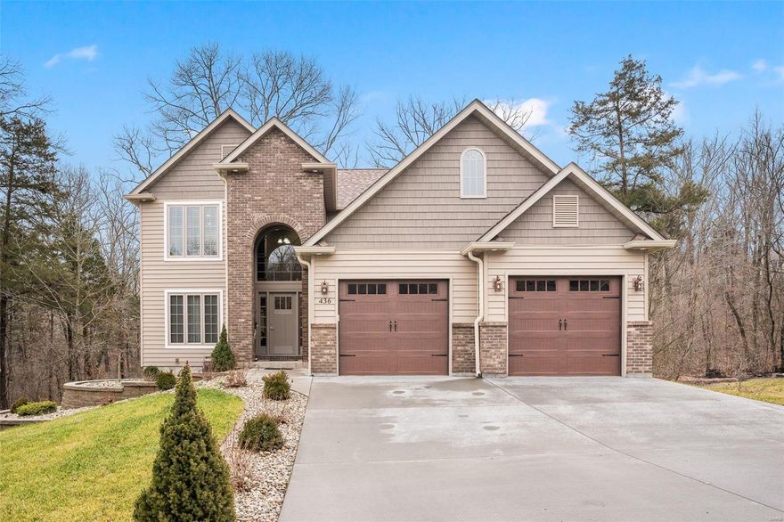 Check out this 2 story in the coveted Twin Lakes Subdivision! This home bolsters an elegant exterior featuring energy efficient vinyl insulated siding; accented by shaker siding in the gables and a grand brick entrance. The custom exterior doors features custom aluminum frames for rot free. As you enter the living room you will love the open floor plan featuring a 17 foot ceiling large dining room along with a custom gourmet kitchen featuring all custom wood cabinets, grand island, granite countertops, whirlpool stainless steel appliances along with custom back splash.  The floor features hickory hard wood flooring with scraped plank tile in the kitchen and Italian designer tile in bathrooms and laundry room. The main floor also has a large master with his and her walk in closet along with subway tile shower and tub. The upstairs has three additional large bedrooms a full size bathroom and an additional room for office storage space.  This beauty has too many upgrades to list.