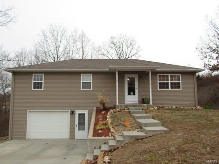 **SOLD BY ATS, ENTERED FOR COMP PURPOSES ONLY**
Located within minutes to the front gate of Fort Leonard Wood, is this 3 bedroom 2 1/2 bathroom ranch style home with a full finished basement. Walk through the front door into the living room, which has laminate wood flooring. The kitchen has light oak cabinetry and black appliances. The queen-sized master bedroom is carpeted for comfort and has his and her closets. The master bath has a single vanity and shower. The two other bedrooms share a full hall bathroom that has a jetted tub/shower combo. Downstairs there is a family room, 1/2 bath, and laundry room. Other great features include a back deck, single car garage, and a quiet location! Call today to view this home!