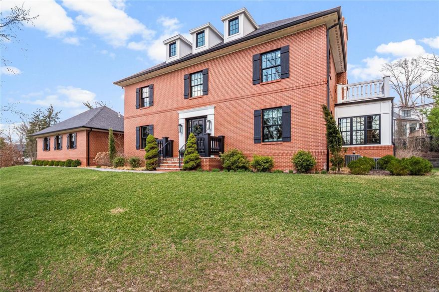 This magnificent seven-year-old Georgian Revival home in a great Ladue neighborhood was meticulously crafted by Kennerly Custom Homes. Designed for luxury and functionality, this two-story masterpiece boasts exquisite crown and casement moldings, a grand box-beam ceiling in the great room and designer lighting. The state-of-the-art chef's kitchen features commercial-grade appliances, marble countertops, custom cabinetry and a spacious center island. The expansive great room shares a two-sided fireplace with the wonderful sunroom. The den offers custom bookshelves and a cozy window seat. A custom staircase with a solid brass handrail leads to four luxurious suites, each with private baths. The master suite is a sanctuary with custom woodwork, dual closets and a beautiful bath. Additional highlights include hardwood floors, 3 HVAC systems, Sonos sound system and whole-house water filter. The lower level features an office, rec room, fifth bedroom, gym, wet bar and ample storage. Additional Rooms: Mud Room