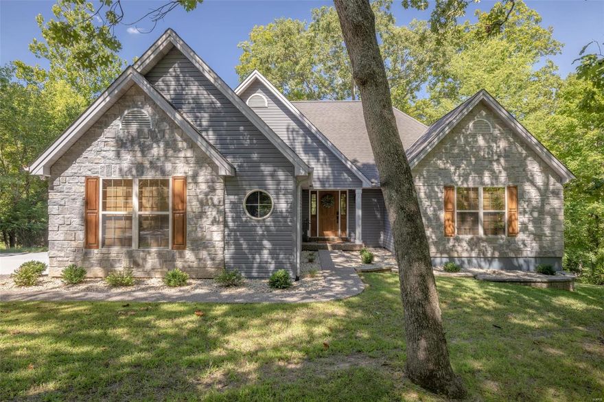 Exquisitely remodeled from top to bottom. Turn Key Professionally decorated includes most  furnishings. See attached Exclusion List
Space, sophistication, and – best of all- stunning lake views are all yours at this spectacular Lakefront home on sought after Lake Charrette. Bring the whole crew and live comfortably with four roomy bedrooms, and adorable bunk room, three beautifully remodeled full baths and many stylish hangout spaces indoors and out.  Stunning remodeled kitchen opens to the large great room with stone fireplace and a huge wall of windows. Off the great room is an expansive upper level deck perfect for lounging around the gas firepit and enjoying the views.  The lower level boasts a fabulous rec room that comes equipped with pinball games and arcade games all walking out to a large patio area. Gentle slope to adorable fire pit area and private lakeside dock.