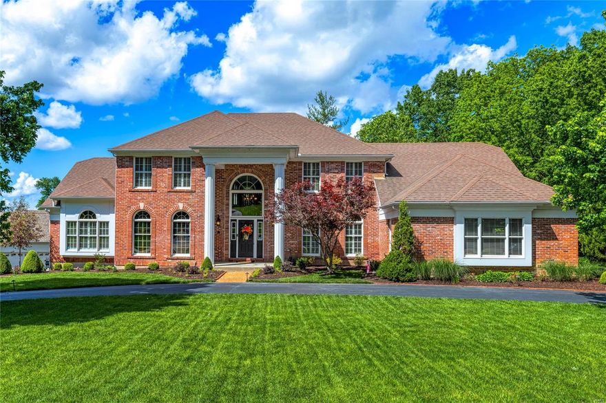 This exceptional Mayer showcase home features well-proportioned rooms with oak hardwoods, soaring ceilings, detailed trim work & plantation shutters. Impressive 2-sty foyer leads to library-paneled study with built-in bookcases, formal dining room & stunning great room with floor-to-ceiling brick fireplace & 2-sty windows with private wooded views. Designer kitchen with glazed cabinetry, granite countertops, KitchenAid appliances & 8’ center island adjoins breakfast room with convenient planning center & pass-through bar. Vaulted primary bedroom suite with marble bath offers an appealing retreat. T-staircase accesses 3 additional bedrooms, 1 with ensuite bath, hall full bath & bonus loft room. Lower Level entertainment space includes recreation room with stacked stone fireplace, game room, gathering bar, office, workout room & full bath. Premium .54-acre cul-de-sac lot with hot tub, deck, covered patio & flagstone patio with firepit & fountain. Tennis courts & pool are just steps away.