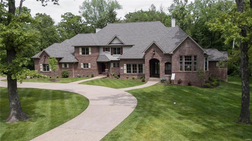 Offered by Kennerly Custom Homes on a gorgeous 1 acre lot. Huge 4 car side entry garage. Aggregate walks & drive. Marvin windows. Solid walnut entry door. 2 fireplaces. Crown & casement moldings through most of the house. 7 1/4” base. 12’ ceiling in great room. Commercial grade appliances. Huge kitchen island with marble tops. Open to Hearth & Breakfast rooms. Butler pantry with bar sink & beverage center plus a 10' walk in pantry. 18x16 Veranda off the Hearth Room. Master bedroom has coffered ceiling with crown. His and hers walk in closet & luxury bath with heated floors. Vaulted ceiling & bay in the den. 4” Hardwood.  Family foyer/mud room with powder room, cubbies, cabinets, & cooks office that's accessed from the garage and the 2nd family entry in front.  Upstairs features a family room, 3 huge bedrooms with private baths & walk in closets, plus a second laundry room. 3 zone HVAC. Full landscaping, sod, & sprinklers. Stereo & alarm. 1217 sq ft of basement finish with bath.