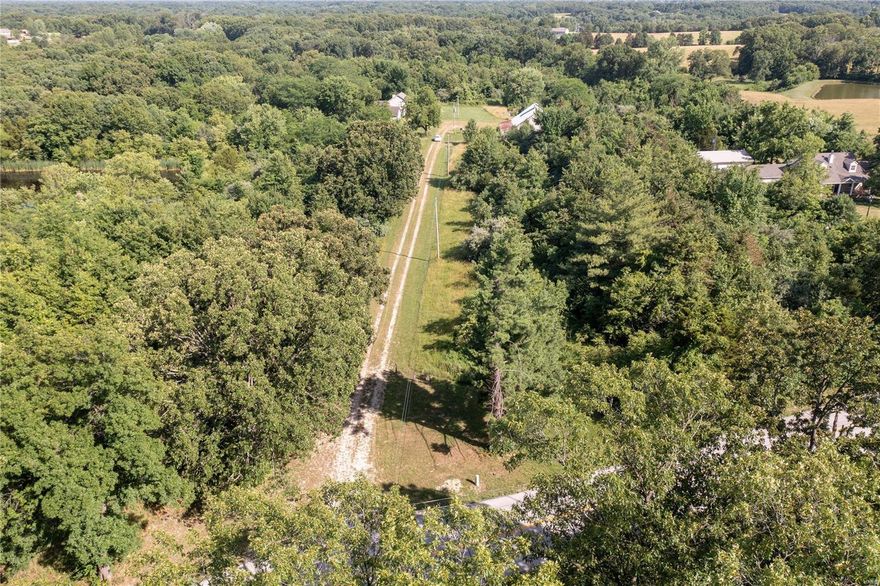 Location is KEY! 10 minutes from Dardenne Prairie, 8 minutes from Hawk Ridge/ LSL & 6 minutes from Daniel Boone Ele. School! Where else can you get a sprawling 35 +/-ac of beautiful countryside in FRANCIS HOWELL SCHOOL DISTRICT than Hopewell Rd? With 820ft approximately of road frontage the options are endless. Public water access & private gravel drive already present. Stock the approx. 1ac pond & relax on your new oasis. Perfect location for 5ac custom homesites, family compound or a single family residence on this beautifully wooded parcel. Perfect for horses, cattle, mini- farm/ homestead, etc. Barn is 1860s (no historical status) but with some TLC has significant potential. Enjoy the benefits unincorporated St. Charles County has to offer!