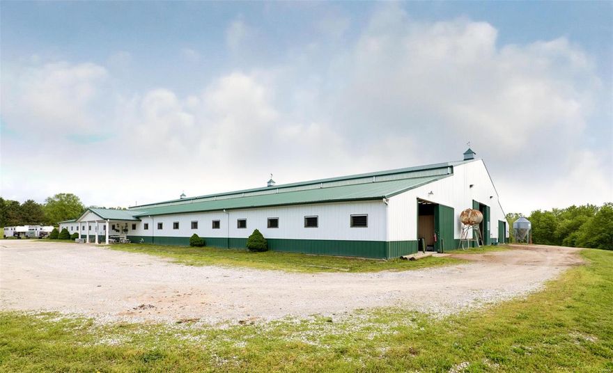 Remarkable equestrian facility on 28+/- acres! Currently used as a commercial boarding and training facility but would also make for a wonderful private estate. Desirable location across from Brommelsiek Park with numerous equestrian trails, and adjacent to Busch Conservation area on Hwy DD. The 40- stall barn (200' x 144') is heated and insulated with a 190'x72' indoor riding arena (footing re-surfaced recently). The 350' x 225' outdoor arena has all weather footing. New high tensile fencing throughout the property. There are 8 paddocks that have vinyl coated fencing for safety. The main house (currently rented) is a custom built 1 1/2 story, 4 bedroom, 4.5 bath home with sunroom. There is also a 3-bedroom caretaker house with outbuilding, and a mobile home on the property. Property also has a 3+/- acre lake and room for trailer parking. Close to major highways and all amenities. Francis Howell School District. If horses are your passion, schedule a private tour today!