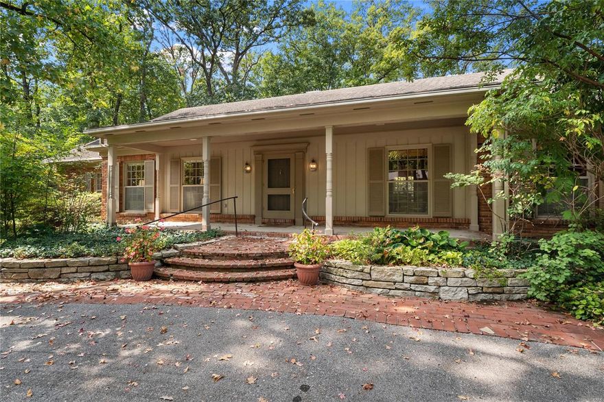 This exquisite property is on a generous 1+ acre lot within Frontenac's beloved Portland neighborhood. Located in the sought-after Ladue School District, the 3-bedroom, 3,266-square-foot home offers an array of exceptional features, such as the expansive main floor primary bedroom suite with a generously sized walk-in closet. A bright, formal living room flows to the family room with a fireplace and wet bar. The sunroom features large picturesque windows and French doors that lead to the charming patio and private backyard. Updated kitchen with white custom wood cabinets, granite counters, and a large center island. The spacious wood-paneled room off of the kitchen can be used as a dining room or main floor study. Upstairs you will find 2 additional bedrooms and bathrooms. Finished lower level with a recreation room, half bathroom, and tons of storage. 3 car garage.