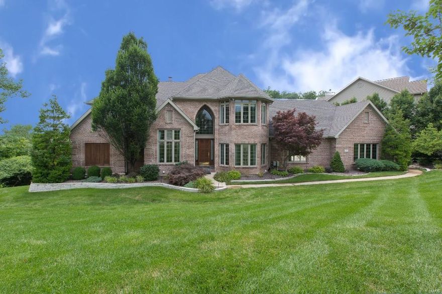 Your castle awaits you! This elegant display quality home boasts 6000+ sq. ft. of exquisite living space. Every room & view is magazine worthy.. no detail overlooked. Main floor master suite is reminiscent of Bellagio hotel w/ luxurious spa bath - his/her closets & vanities. Gourmet kitchen is bright w/ elegant dining area that overlooks an outdoor kitchen alcove and lush grounds. Other features include beautiful woodwork and paneling, inlaid carpet, columns & marble glazing, custom window treatments, hand-painted walls. A handsome library features rich wood paneling/bookcases...gorgeous views of extensively landscaped grounds from every room, walk-out finished LL with wet bar, FR w/ stone fireplace, billiard room, game room & home theatre...perfect for entertaining! 2nd level has elegant great room that opens up to 2nd floor balcony, 2 stunning bedrooms w/ private baths & 3rd bedroom/home office. You'll be WOWED by the garage! Every room is special! This is truly a unique estate!