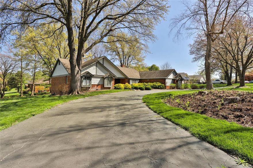 Fabulous ranch sitting on over an acre lot in sought after Barrington Place.  Gorgeous entry foyer with stately staircase is open to large great room with stone fireplace, beamed vaulted ceiling & huge windows overlooking the lush backyard. Spacious dining room with bay overlooking front yard.  Fabulous kitchen with custom cabinets, center island, quartz countertops, viking cooktop, double ovens and a large breakfast area. A cozy den connects the great room and kitchen. There are two main level ensuite bedrooms, both with walk in closets. The walk-in shower in the primary ensuite is spectacular. The laundry room is conveniently located just off spacious mud room.  Downstairs is a huge family room, a rec room, 3 generous size bedrooms, walk in closets galore and loads of storage space.  This turnkey home features gorgeous wood floors, spectacular woodwork and mouldings, a 3 car side entry garage located on a culdesac in Town & Country, close to shopping, restaurants, highways, etc.