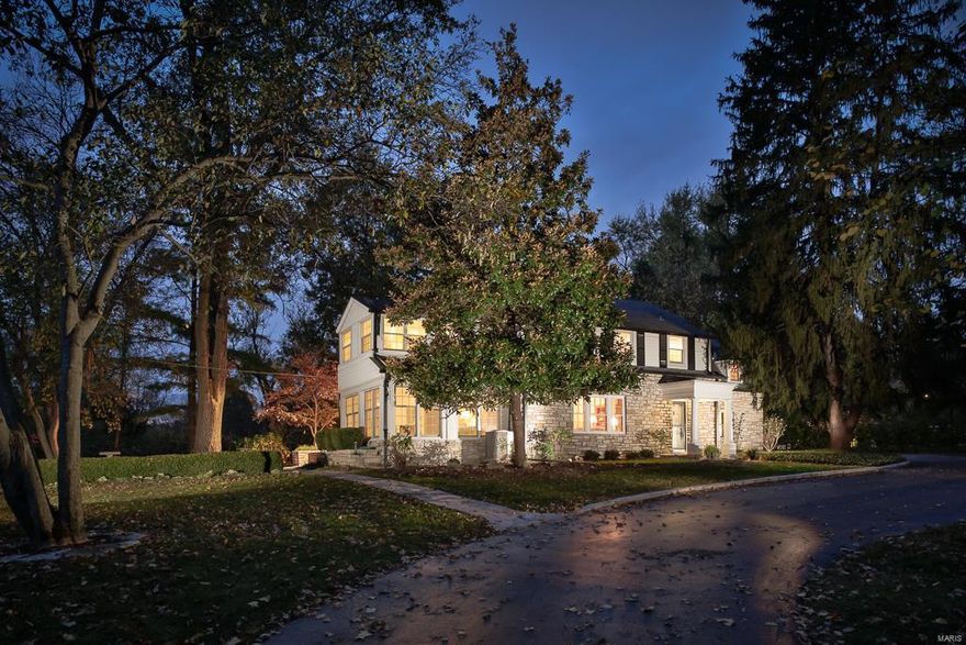 LARGE PRICE REDUCTION!
Charming Stone Cottage style home on gorgeous 1+acres in the heart of Ladue. Abundant architectural features throughout including  softly arched doors, custom built-ins, beamed ceilings, handsome natural woodwork and paneling,extensive moldings and 4 fireplaces. The living room adjoins a formal dining room and a sitting room with walls of windows providing the perfect combination of space for entertaining. The kitchen w/ center island opens to the hearth room & breakfast area, all looking out to the stone & brick patio & beautiful private yard. A 2nd family room is off the kitchen. 4 Bedrooms and 4 full baths upstairs include a master suite with gas fireplace, large bathroom, abundant closet space, and french doors opening to a balcony. The lower level would make a wonderful wine cellar & tasting room with rich woodwork, stone walls and fireplace. Storage and laundry area complete the lower level.  Sprinkler system, security lighting, over-sized two car garage.