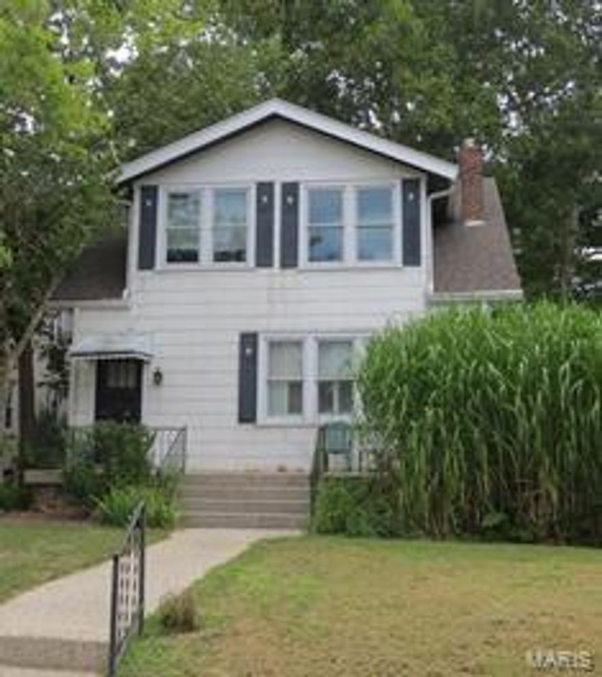 YOU can get into the highly regarded Clayton School System with this very affordable home.   This century old, 1.5 story home  is located in Richmond Heights, just South of Clayton Road.  Owned and loved by a family of six for more than 50 years.  The entry foyer opens to a large living room with traditional fireplace/mantel, separate dining and a spacious kitchen.  The home owners built an addition that houses the first floor master and adjacent full bath.  The cozy room off the dining room will make a perfect den or small family room.  Upstairs has three bedrooms and another full bath.  The East bedroom is 25 x 14 and could easily include a second upstairs bath.  Steam heat throughout the house is provided by a new boiler(less than two years old)  The roof was replaced approximately five years ago.  The .216 acre lot is fenced and allows plenty of room for the new buyer to build a detached garage.
Bring your contractor, your creative ideas and a contract!