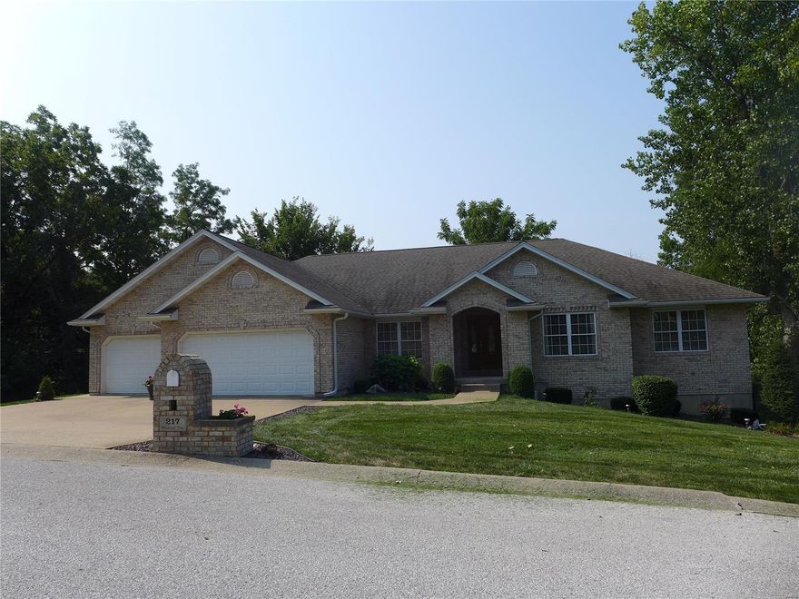 Atrium full brick ranch will provide all the requirements for your next home. Over 5000 square feet of living space. Spacious living room is light and airy with vaulted ceilings, neutral walls and flooring. 4th bedroom on main floor serves as an office. Master bedroom suite has private space. Kitchen with hardwood floors has brand new appliances and eating area. Deck off kitchen just completed with gorgeous composite decking, vinyl railing with solar lights and steps to lower patio. Backyard has black chain link fencing. Lower level has 2534 sq ft of finished living space. Two family rooms have 2 sided gas log fireplace. Exercise room. Large 5th bedroom with full bath and walk-in closet could be Mother-in-laws quarters. Sleeping room provides 6th bedroom. Extra lot (Lot 19 &20) is .89 acre. Established trees and professionally cared for lawn. Three car garage (828 sq ft) is off main level laundry. Ceramic tile area in atrium is great for house plants. This home has been well cared for.