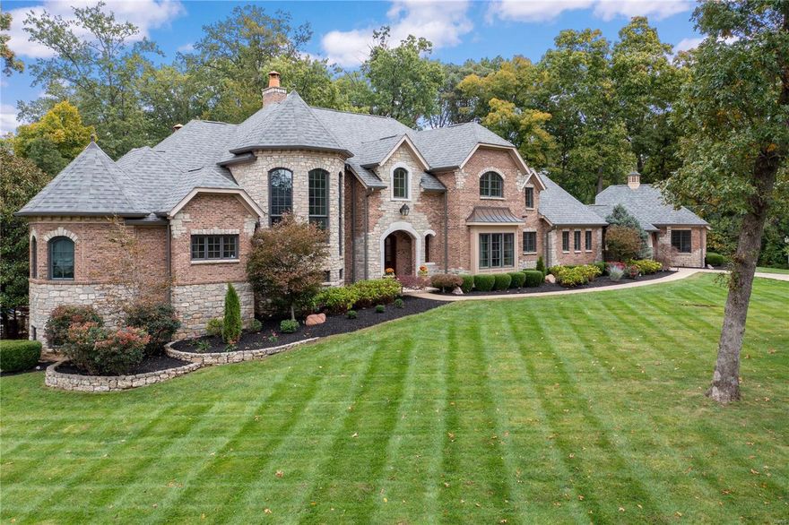 The epitome of luxury living, this custom 1.5 story home, features over 9000 SF of stunning living space. Traditional in design, it delivers the ultimate in casual elegance. Exquisite mill work, soaring ceilings & 5 unique fireplaces, it has it all. The stately 
foyer leads to a 2 story living room, formal dining & private paneled office. The 1st flr primary suite includes His/Her walk in closets, gas fireplace, luxury bath, walk in shower, spa tub & double vanities. The epicurean kitchen, expansive hearth room & open breakfast area are surrounded by windows.  Alluring alfresco spaces include the idyllic outdoor kitchen, & covered patio overlooking the custom pool, spa & waterfall.  A grand staircase leads to 3 spacious en suite bedrooms & loft. The entertainment extravaganza continues in the lower level with an expansive bar, media room, gym, & billiards. PLUS, a 5th bedroom, full bath & wine closet. Porte cochere connects the 2 garages/4spaces. It's architecturally delightful!
 
. Additional Rooms: Mud Room, Wine Cellar