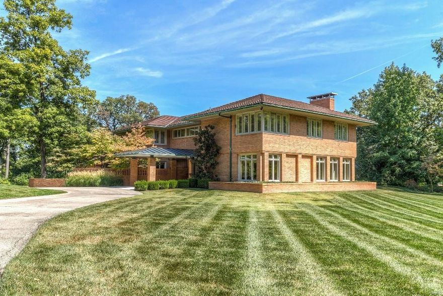 Stunning 2 acre estate in the prestigious StL Country Club. 5 Bds, 7 Bths (5F/2H), 7,400+ sqft of living spc. Entry w/stone floor & Italian marble staircase, Living Rm w/custom frplc, & Dining Rm w/granite counters. Gourmet Kitchen w/island, SubZero fridge & freezer, Thermador cooktop, Bosch dishwasher, quartzite counters & Hearth Rm w/Wet Bar & copper counters. Stylish Powder Rm & Laundry Rm complete the 1st Flr. Stairs or elevator leads to 2nd Flr w/Master Ste, His/Her Bths, Jacuzzi tub, steam shower & Dressing Area w/built-ins. 2nd Flr also finds: 3 add’l Bds & 2 add’l Bths. Finished LL w/Rec Rm, 5th Bd, full Bth, & storage room w/shelving. Top-Rated Ladue Schools! 3 car attached garage & updates/upgrades thru-out! Relax outside, on the patio w/fireplace, or on screened-in porch & admire the private, park-like setting yard. Perfect home for entertaining family & friends! Great location—minutes to restaurants, shops & galleries. Close to hwys!