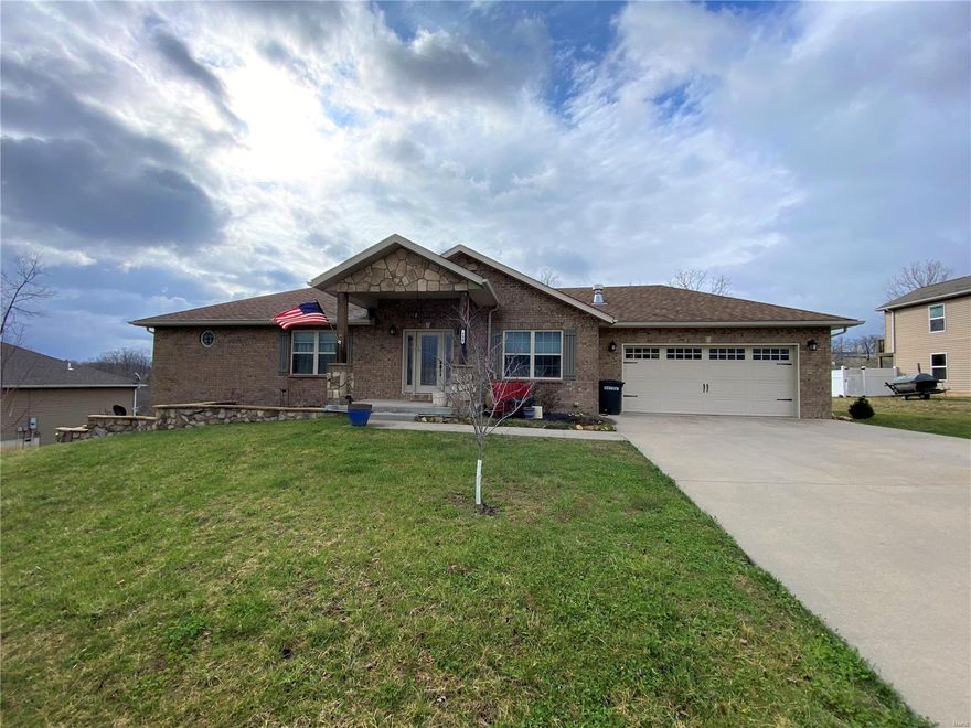 STUNNING 4 bd, 3 ba home w/ approximately 3000 square feet sitting in the highly sought after Woodridge Subdivision. Step inside the spacious living room & notice the beautiful hardwood flooring, crown molding, tray ceiling & zoned heating propane fireplace. Kitchen provides custom cabinetry, gorgeous granite countertops, subway tile backsplash, stainless steel appliances, breakfast bar & pantry. The master bedroom features a large walk in closet, access to the covered back deck & it's own private bathroom w/ double vanities, whirlpool tub, tiled shower & a throne room w/ a bidet. The main level also provides a large laundry room & second guest room. The walk out basement features 2 electrical fireplaces in the family room & media room. There are two generously sized guest bedrooms-One w/ a large walk in closet & another fully renovated bathroom. You'll love the fenced in backyard & raised garden beds & a yard your neighbors will envy. Don't miss the chance to make this your next home!