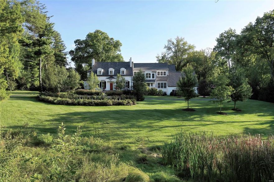 This historic home in Ladue has been extensively remodeled into a spacious and elegant New England-inspired home with modern, energy-efficient features. A winding driveway leads through almost three acres of park-like landscaping to the home sitting back 360 feet from Ladue Road. A gracious entry hall opens to the living room with fireplace, the dining room with adjacent marbled butler's pantry, and library with cherry wood book cases and paneling. The home is light-filled, with ample windows bringing the outdoors inside, and 9’6” ceilings throughout. The airy Master Bedroom and sitting room overlook the sweeping lawn and pool setting. The Lower Level has a Media Room, a dedicated workout room, and a Rec Room with wet bar. The home has a geothermal heating and cooling system, a roomy second-floor laundry room and an artist's studio with skylights. A remarkable family home filled with charm, elegant features and practical assets. Additional Rooms: Mud Room
