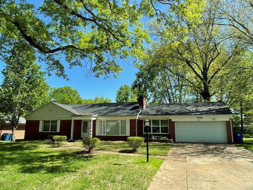 Spacious brick ranch with tons of upgrades......new roof, new flooring, and new windows. Stainless steel dishwasher/microwave/range/refrigerator, kitchen sink, counter tops, cabinets, bathroom vanity and more are all new! Lovely wall to wall masonry wood-burning fireplace with built in bookshelves in a large living room.  Ceiling fans.  Two car garage. The property sits on half an acre with a large flat back yard and is on a quiet cul-de-sac street.