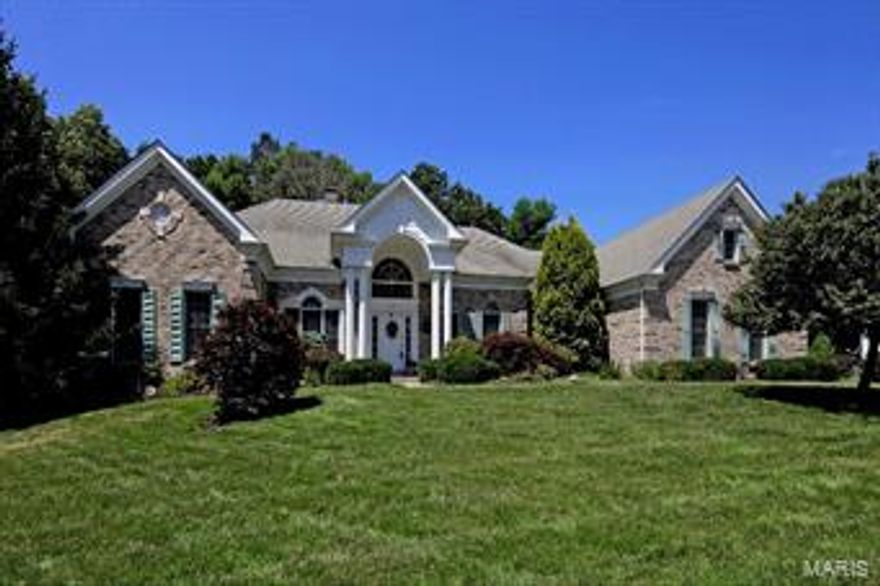 Beautiful ranch backing to trees. Vaulted great room with fireplace and dry bar area. Large dining room with crown and chair rail molding. Off the foyer is the living room/office with built-in shelves.  Wonderful kitchen and breakfast room with wood floors, granite counter tops, center island with gas cook top, stainless steel appliances and slider to deck.  Open from the kitchen is the adjoining vaulted heath room with fireplace and a sliding door to the enclosed sunroom. Spacious master suite with coffered ceiling, crown molding, walk in closet and luxury bath with jetted tub, separate walk-in shower, two vanities and an additional walk-in closet. Two additional bedrooms are on the upper level, each with a full bath.  The walk out lower level has a rec room with gas fireplace and walk behind wet bar, an exercise room, den/changing room with access to the hot tub outside, two bedrooms and a full bath. Three car side entry garage, level lot and sprinkler system. Additional Rooms: Sun Room