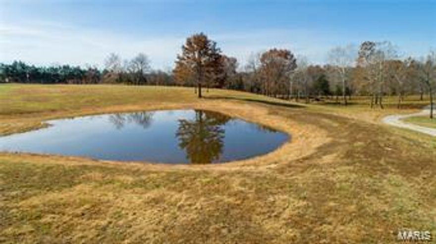 LOCATION IS EVERYTHING!!! 9.2 ACRES IN A PARK LIKE SETTING. THERE IS ALSO A POND AND A SPRING FED LITTLE CREEK WITH A BRIDGE OVER THE DRIVEWAY. THERE ARE NO RESTRICTIONS ON THIS PROPERTY.  JUST WAITING FOR YOU TO BUILD THE HOME OR SHOUSE OF YOUR DREAMS! TRULY A MUST TO SEE!