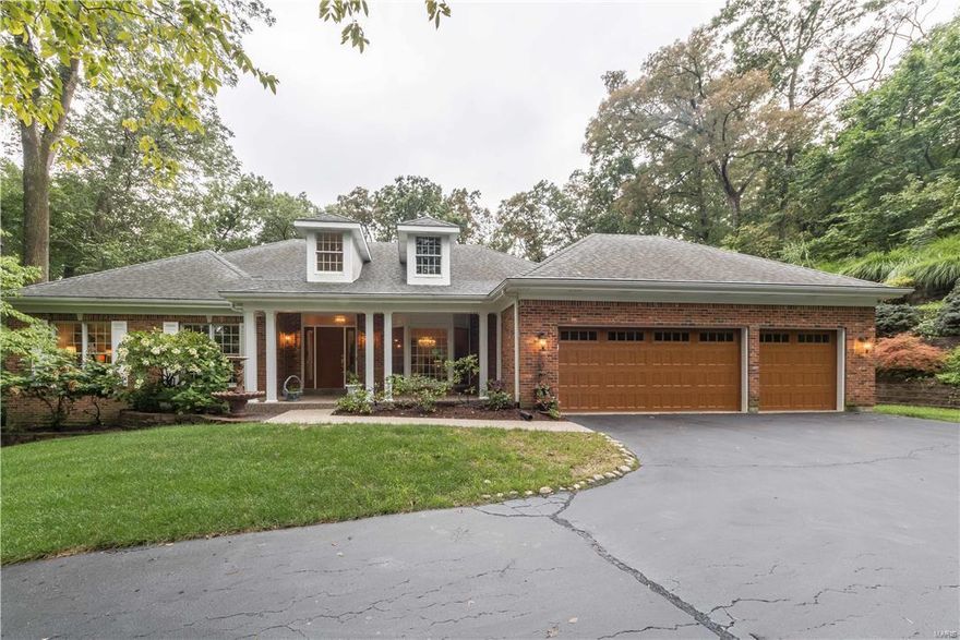 Private & secluded ranch in the highly sought after Chesterfield Estates on 1.66ac. 4 bdrms, 3.5 bath home that will wow you as soon as you walk in the grand marble flr foyer leading to the GR, Den or Dining rm. Enter the den thru stately french drs or dining rm thru encased dr frames, feat bay wndw & vaulted ceilings. The open large GR has vaulted ceilngs w/ natural light that fills the rm thru skylghts, gas marble surround FP, wetbr w/granite & leads to large deck. Chef's Delight Ktchn feat islnd w/vegsink, cstm cab, granite counters, SubZero fridge, gas Thermador cooktp w/h20 faucet, 2 dshwshrs, dble oven w/top as convection/mircro, Viking wine fridge & leads to brkfst rm & hearth w/woodbrning FP. MF master feat 2 huge walkin closets, marble flr & counters w/2 vanity, jettub & walkin shower. Guest rm, full & half bath & laundry completes MF. LL feat recrm, 2 bdrms, full bath & cedarcloset. The backyard privacy is priceless. You are sure to fall in love w/ everything about this home!