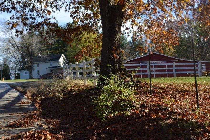 Charming, Historic Farmhouse on 4.5 Acres with Private Pond, Horse Barn/Workshop Garage & Fenced Pasture. On quiet street, just off Highway 109 in Wildwood. Home has 4 Bedrooms and 2 full  Baths plus Loft/Den/Office. Wood Floors, Newer Carpet, Newer Windows and Unfinished Walkout Basement w/ Drain Tile.  The Spacious 60' x 60' Steel Barn has a Steel Roof,  Electric & Water services.  The Barn is divided into 2 Areas of Use, a Garage & a Traditional Barn.  The 2 Car Garage Area features heated floors and the Barn Area has 2 Large Animal Stalls and 3 Small Stalls.  HORSE PROPERTY, there is a fenced pasture area. This Property has No Subdivision Restrictions and with the Water View, would be the Perfect Location to Build a Future Dream Home while living in the Farmhouse.  Public Water. Rockwood Schools/Lafayette H.S.  Close to Wildwood & Chesterfield.