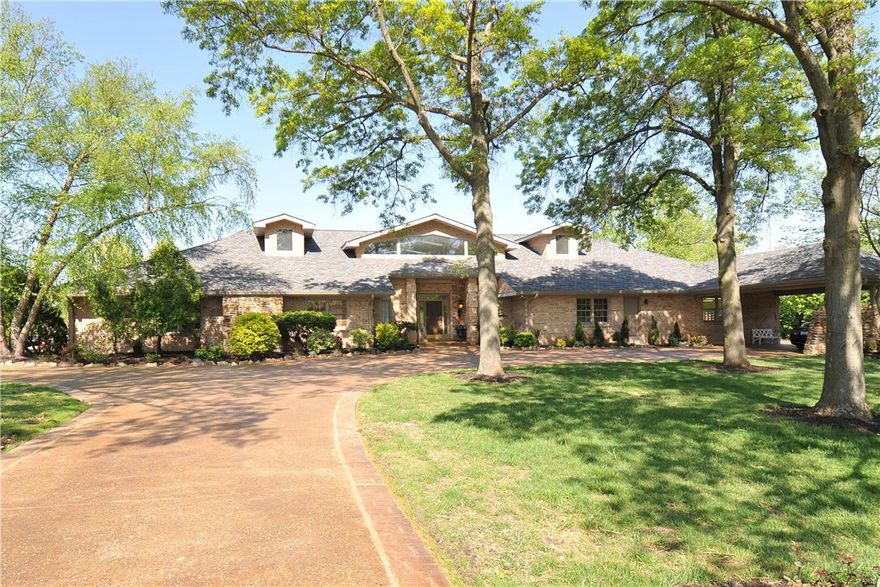 Wow! Fabulous Town & County 1.5 story with 6+ bedrooms and 9.5 baths! This home also has an indoor lap pool and outside inground pool, home theatre, steam room and sauna, full workout room and more! Must see to believe!   Additional Highlights incl:  Huge entry foyer with winding staircase! Beautiful walnut floors through main entry! Custom built kitchen with 1 sub zeros refrigerator and 1 subzero freezer!, dual dishwashers, built in ice makers, island with 5 burner gas cooktop, & 2 beverage centers! Breakfast bar overlooking hearth room! Main floor laundry! Main floor wing that features 3 bedrooms w/ 2 full baths!   Master bedroom suite with gas F/P, wet bar & custom bath that includes separate tub/walk in shower, heated floor and towel warmer!  Manicured backyard complete with large patio and in ground pool!  Fantastic Finished lower level!! ! Separate carriage house perfect for in-laws/maid quarters includes full kitchen, bath & 2 bdrms! Could be converted to garage!  Show & sell!!!