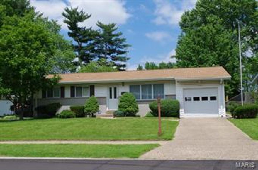 Lovely ranch home is ready for new owners! Hardwood floors in living rm and all bedrooms.  Bay window in second bedroom.  Neutral décor throughout.  Freshly painted. Updated bath vanity. Partially finished lower level with butler bar that was hand finished in copper tiles.  Well cared for home has park like backyard with  brick paver patio, storage building, gas grill remains as is. Exterior has permanent flag pole, epoxy stone driveway and partially covered patio areas, irrigation system (as-is), exposed decorative brick and built in cabinetry in basement, heated garage, built in workshop in basement. HSA home warranty included! This one owner home shows pride of ownership throughout and is in move-in condition.