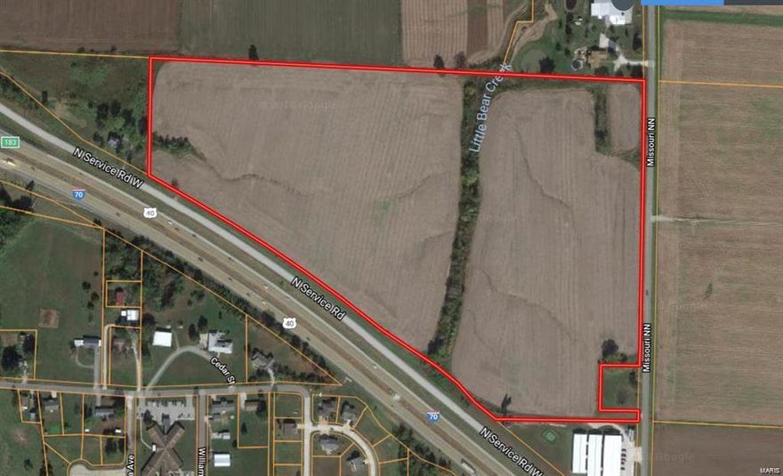 Prime Commercial with over 2,000 feet of frontage on the North Service Road and a quarter mile of frontage on State Hwy NN on the East side of the property. 92% Tillable! Just a quarter mile East of the Overpass at Jonesburg. All public utilities available! Very level and open! Perfect for Development! Location: High Traffic