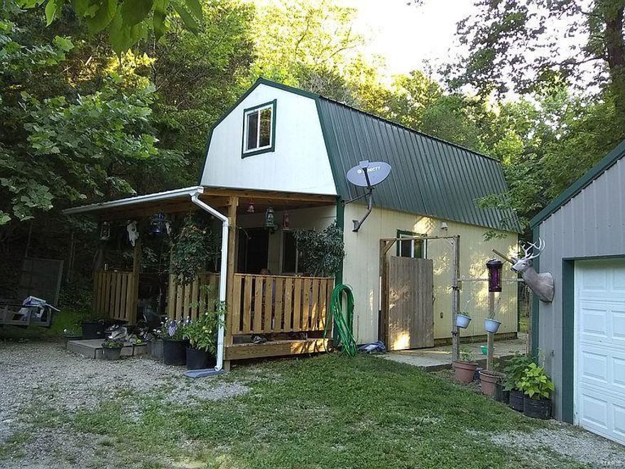 Nestled in the Ozark Mountains, this tiny house has it all. 5 acres with year round creek and spring situated in the heart of Mark Twain National Forest. Just a short walk to the Big Piney River and a mile from Spring Creek Blue Ribbon Trout Stream. This is the perfect home or weekend get-away for the person who truly enjoys the outdoors. Hidden in plain sight this property is beautifully landscaped and has excellent set of outbuildings. Property has a variety of nut trees, Black walnut trees, weeping willow, Day lily flower garden and thorn-less blackberry bushes. Just 4.5 miles from Ft. Leonard Wood.