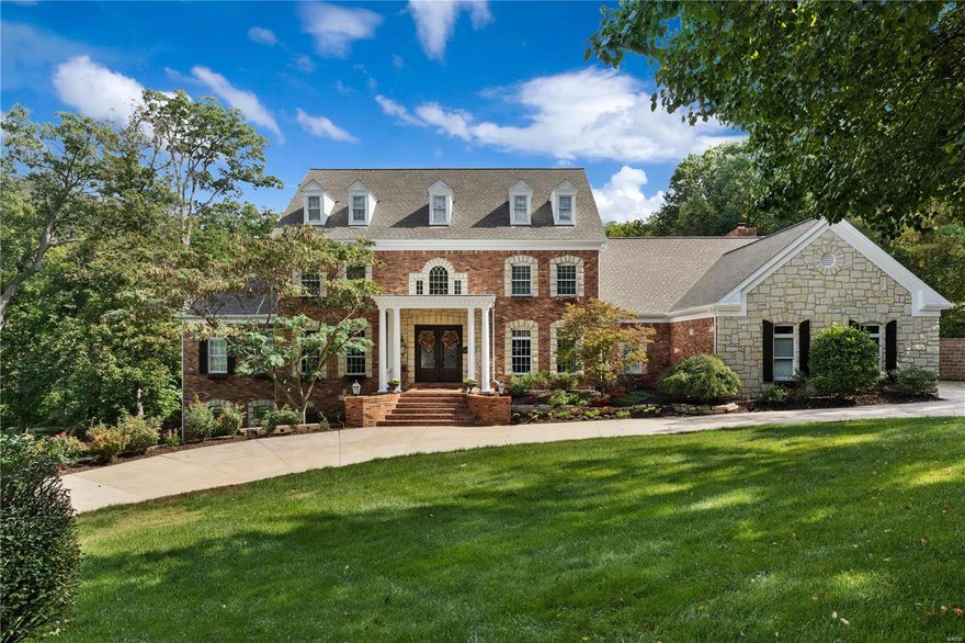 This spectacular John Porta-built Estate home features an impressive brick & stone elevation, portico & 8’ leaded glass doors to create amazing curb appeal! 2-Sty marble foyer with dramatic flared staircase opens to library-paneled study with custom built-ins, elegant dining room and stunning great room with wet bar & floor-to-ceiling stone fireplace flanked by 2-sty windows. Chef’s kitchen with 42'' white cabinetry, granite countertops & professional quality appliances adjoins breakfast room with convenient planning center & vaulted hearth room highlighted by stone fireplace. Coffered master bedroom suite with beautifully appointed bath with Jacuzzi offers an appealing retreat. T-staircase accesses 3 additional ensuite bedrooms. Lower Level features recreation room with stacked stone fireplace, media room, game room with adjacent music studio, 2nd kitchen & full bath. Outdoor living area includes resort style pool surrounded by landscaped gardens plus deck & terrace with fireplace. Additional Rooms: Sun Room