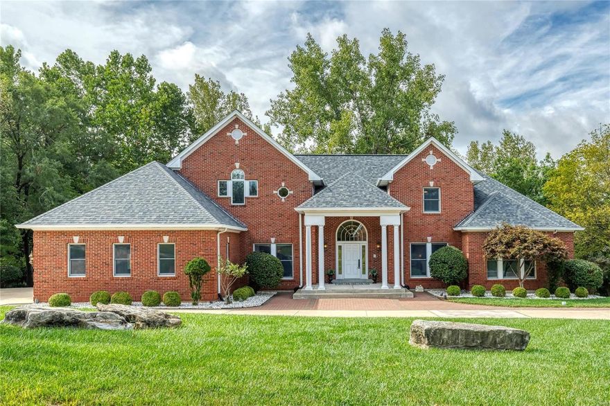 Wow! Circular driveway leads to a rare opportunity to own a home in Town & Country’s coveted Topping Pt. Estates. This is a beautifully maintained home w/ unique features & a wooded private back. A large open foyer welcomes you! Just off the foyer an elegant dining room & living room/study awaits. Gorgeous vaulted great room is accented w/ soaring exquisite gas fireplace. Gourmet eat-in kitchen features granite countertops, wine-cooler, Thermador refrigerator, dishwasher, oversized 6 burners/griddle stove w/double ovens. Spacious breakfast & hearth room is an ideal space for entertaining. MF master suite w/luxury ensuite has custom closet & a private deck. MF 2nd bedroom w/private bathroom is perfect for a nursery or guest quarters. Two large bedrooms suites with baths & walk-in closets on 2nd floor. Basement features spacious rec areas, full kitchen, bar, bedroom, sleeping area & full bath. Zoned Geothermal HVAC, 3 car garage, fenced lot. Close proximity to highway, shopping & more..