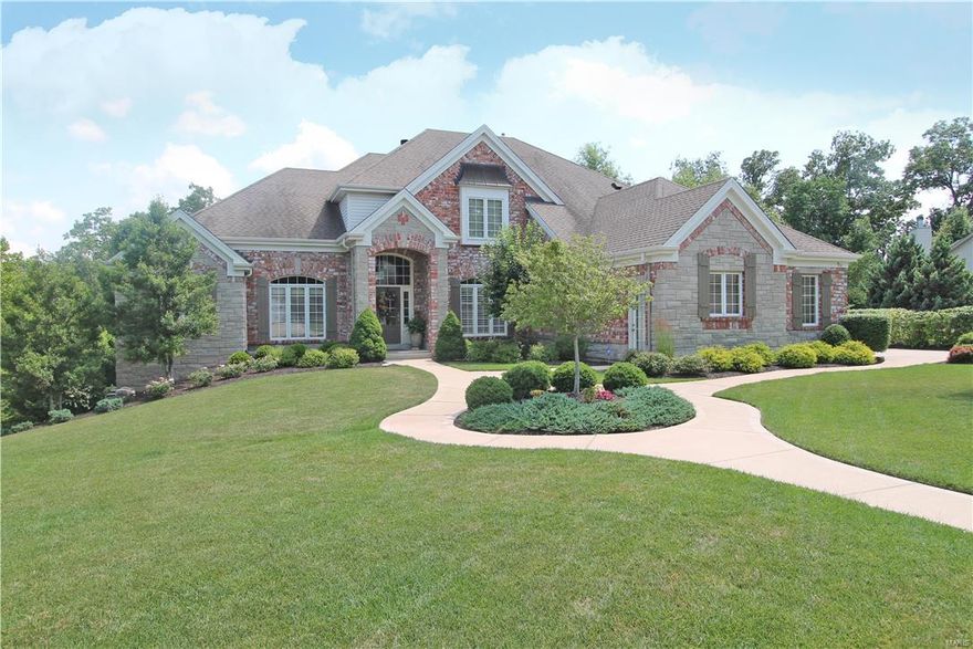 Gorgeous home offering a brick & stone elevation, 4 car finished drywalled & custom floors, 4th car oversized garage features a breeze way to enter mud room. Heated salt water pool. Outdoor kitchen with commercial grade grill, granite counter top, stone bar, pizza oven & drink refrigerator, 2 Outdoor Fireplaces. Elegant 1.5 Story home,5 bedrooms & 6 baths. 20 foot ceilings in the entry & great room. Elegant pillars, 6 total fireplaces. Luxury master bedroom suite on the main level w/lighted coffered ceiling, sitting room gas fireplace, stunning bath & enormous walk in closet custom organizers. Home office/Den built in bookcases, chandelier & 12ft ceiling. Great rm offers a wall of windows, 20 ft ceiling, gas fireplace & exquisite window treatments. Hearth rm with stone gas fireplace, custom window treatments. 6 burner gas range, built in refrigerator & micro,walk in pantry custom organizers. Breakfast rm bay window, open to lovely screened in porch with gas FP, grilling deck.