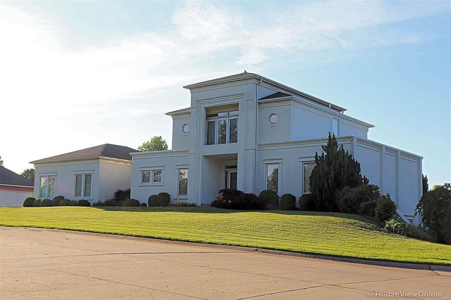 Brilliant natural light and soaring ceilings provide a stunning combination in this one-of-a-kind designer home; yet for all its style, there was no compromising comfort. Immensely livable, you'll feel welcome when you step inside. The foyer leads to a 2-story living room w/a wall of windows & a fireplace w/built-ins. Newly restored hardwoods gleam and lead to the kitchen and its brand new quartz counter-tops, high end appliances & walk-in pantry. Pass the large laundry room on your way to the over-sized 2-car garage w/storage. On the other end of the home are two bedrooms and a luxurious main-level bath. The 2nd floor is a dedicated oasis of comfort, where the owner's en-suite bedroom is found, w/walk-in closet, designer bath and sitting area. The lower level has a large family room, kitchenette, two bedrooms & a bath, ample storage. The interior has been freshly painted, carpets replaced w/additional updates and repairs. Make your appointment now, & prepare to be amazed.