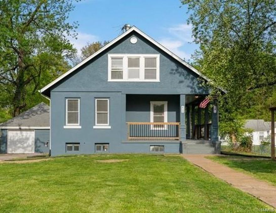 This large charming renovated 4 bedroom, 1 bathroom home is a real find in Ferguson!  This one will forever be that blue house with the big porch we just love!   Where do we begin? The lovely yard with gazebo is perfect for you to be the family gathering spot - so many memories will be made at this homestead.  The brand new kitchen is perfect for preparing sit down dinners in the dining room. Gorgeous refinished wood floors will catch your eye as you enter this home.   Also: the main floor master bedroom allows for some peace and quiet, away from the three 2nd floor bedrooms.  New flooring in all the other rooms is beautiful and gorgeous light fresh paint throughout and the systems are all modern.   The oversized garage is a dream for many, complete with newly poured concrete floor.
