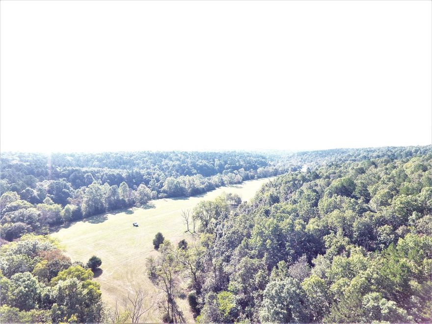 Enormous possibilities exist with this exceptional acreage. 1425 acres m/l of recreational paradise located about 15 minutes south of Salem, MO off Hwy 19 and CR 5510 in Dent County.  After decades in this business I have never seen a better large contiguous acreage that has what this property can offer.  It is absolutely ideal for any type recreation you might anticipate, it is full of wildlife including deer, turkey and many others.  It is mostly timber with several valley open fields suitable for grazing, hay, wildlife plots or even row crops.  It has a spring & spring fed creek running right down the valley in front of a two story home located right in the center of the property.  The home has 5 BR and 1 BA & beautiful wood floors that were actually cut off the property.  A large hip roof barn could be turned into a fabulous stable for horses or whatever suits your needs.  Miles of trails and a huge amount of large oak and pine timber.  This is a once in a lifetime opportunity!