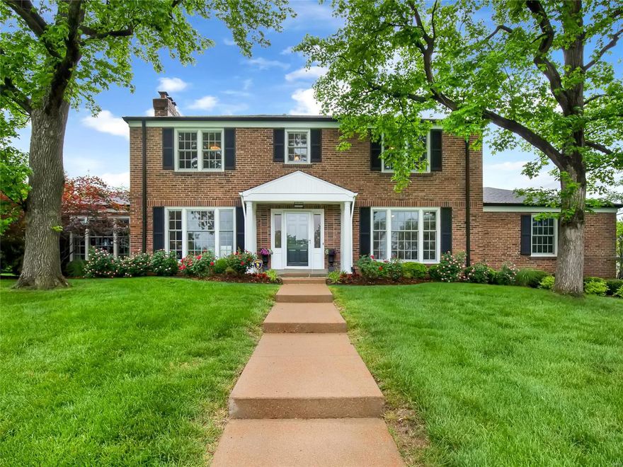 Stately and grand, 15 Hacienda Drive stands tall in one of Ladue’s hallmark neighborhoods.  The current owners thoughtfully renovated this well-appointed brick home in 2008. Step into a gracious foyer that opens to a lovely living room or office and an open, inviting family room with wet bar and gas fireplace. Separate Dining room with coved ceiling and second gas fireplace. Chef’s will delight in the large eat-in kitchen with enormous center island, two dishwashers, Subzero fridge and custom cabinetry. Main floor laundry room. Large master bedroom suite with WIC and separate shower and whirlpool tub. 3 additional bedrooms complete the upper level with one hall bath servicing two and one en-suite.  Finished lower level includes a large rec room, kitchenette, full bath and sleeping quarters or fitness area. Lovely covered porch, 2 car attached garage.  Don't miss this stunning home situated on a 1/2 acre, corner lot with mature landscaping